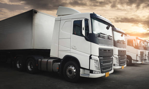 istock Cargo freight transportation. Semi truck on parking at sunset sky. 1264980374