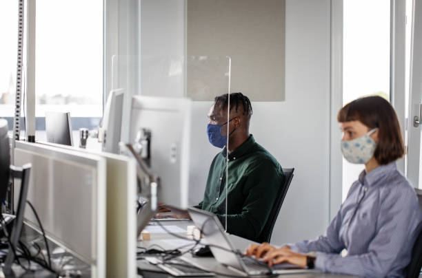istock Business people working at office with glass partition 1264980559