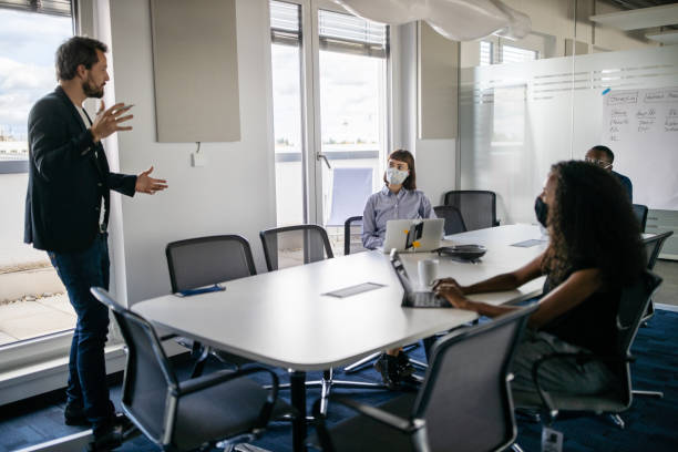istock Business presentation during corona virus pandemic 1264981264