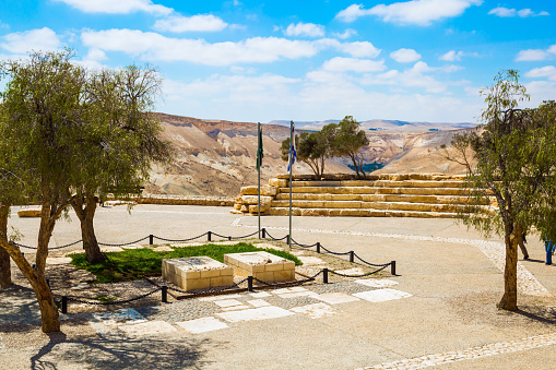 Graves of David and Pauline Ben-Gurion. View of the landscapes in the valleys of the Qing and Ramat Avdat. Steep rock on a natural plateau. The concept of historical and photo tourism