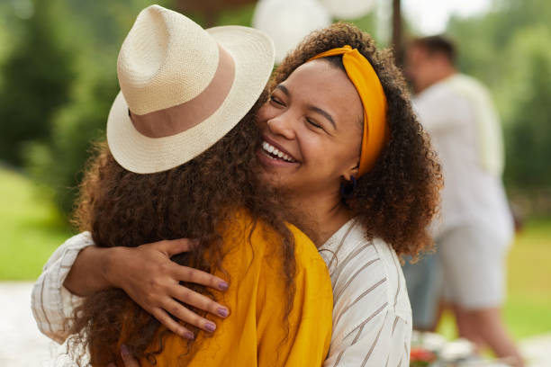 istock Friends Hugging at Summer Party 1264985259