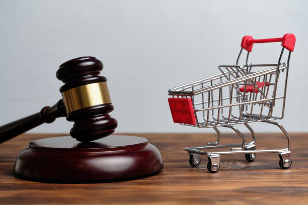 istock Judge hammer next to the store trolley 1264987667