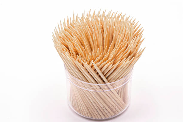 istock Close up wooden toothpicks in a box isolate on white background. 1264998081