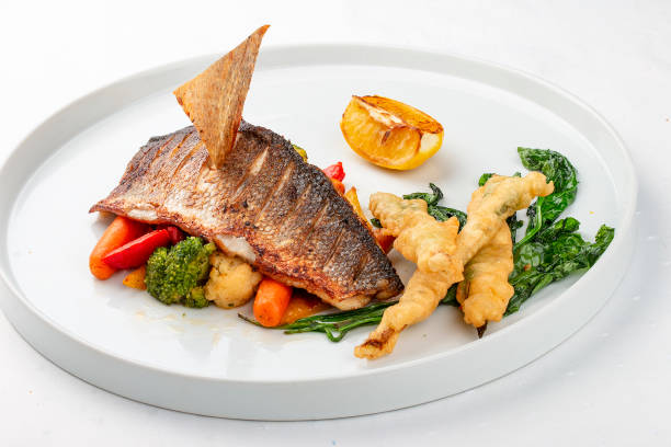 istock Sea bass fillet with steamed vegetables 1265001721