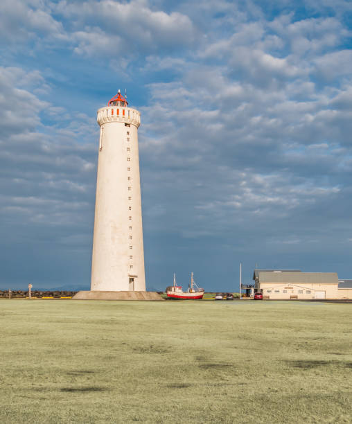 istock Lighthouse on coast of SW Iceland. 1265003248