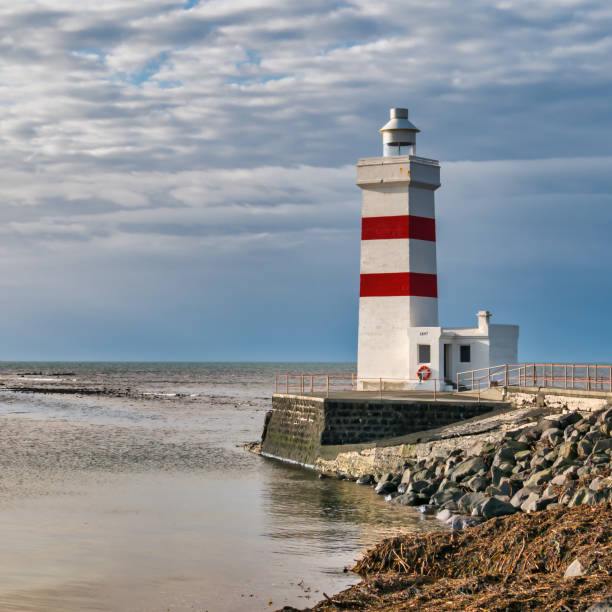 istock Lighthouse on coast of SW Iceland. 1265003266