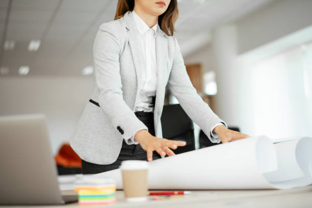 istock Beautiful young businesswoman working on projects. 1265006048