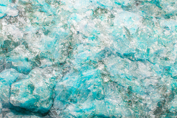 Light aquamarine stone background with microcracks, splashes of quartz and fine texture