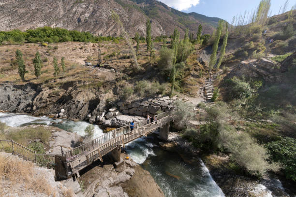 Tortum Waterfall in Erzurum - Turkey 28 August 2019 : Tortum Waterfall was formed by the pouring of Tortum Lake over the landslide mass in Tev Valley. It has a width of 21 meters and a height of 48 meters. A wooden bridge was built for people on the powerful flowing waters of the waterfall.