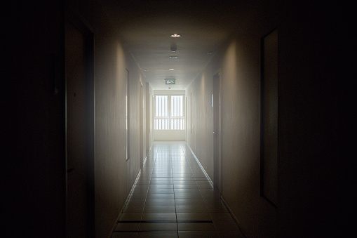 Dark and light corridor in the apartment.