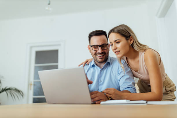 istock Cute couple looking at laptop, portrait. 1265009567