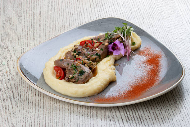 istock Lamb tongues with mashed potatoes, stewed in a sauce with thyme and herbs 1265009625