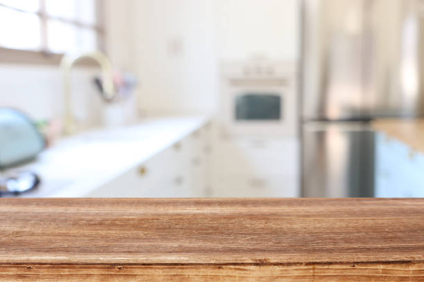 istock empty table board and defocused modern kitchen background. product display and picnic concept 1265010361