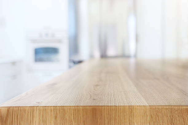 istock empty table board and defocused modern kitchen background. product display and picnic concept 1265010366