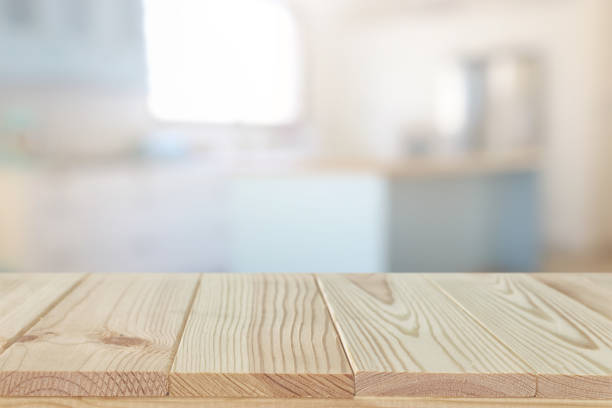 istock empty table board and defocused modern kitchen background. product display and picnic concept 1265010370