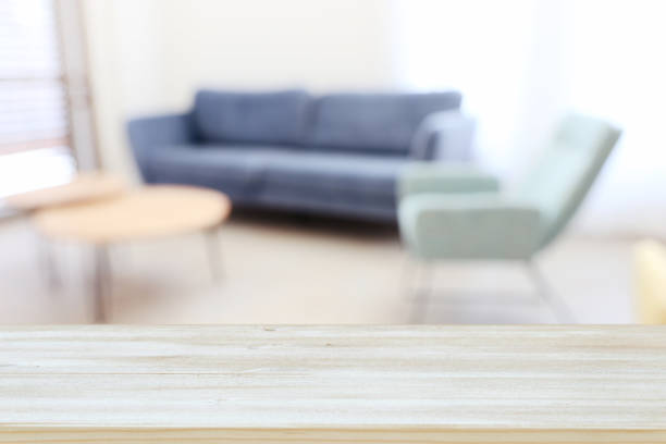 istock Wooden empty table in front of Living room sofa interior. For product display and presentation 1265010376