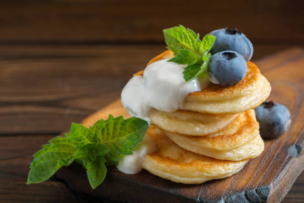 istock Cottage cheese pancakes, syrniki with fresh berries. 1265012673