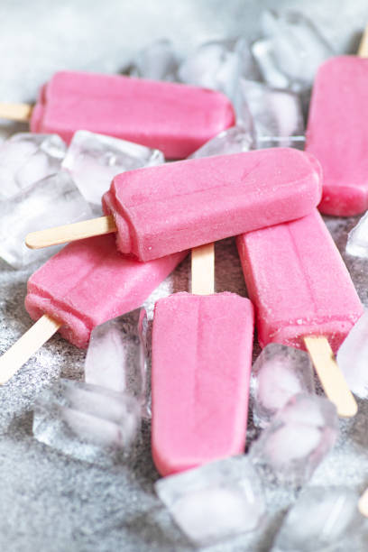 istock Refreshing strawberry ice pops - popsicles - on gray background with ice. Healthy summer snack. Close-up 1265012709