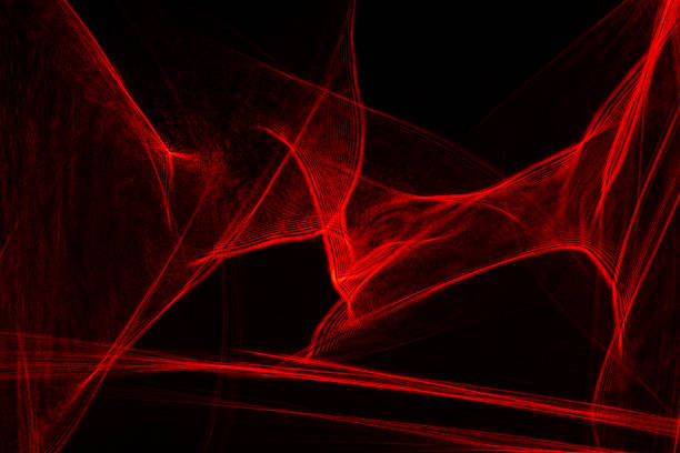 istock Abstract red lines drawn by light on a black background 1265013165