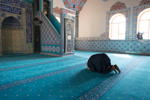 istock Muslim woman praying 1265013396