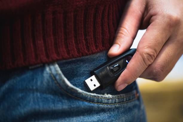 Picture of a black flash drive from jeans. stock photo