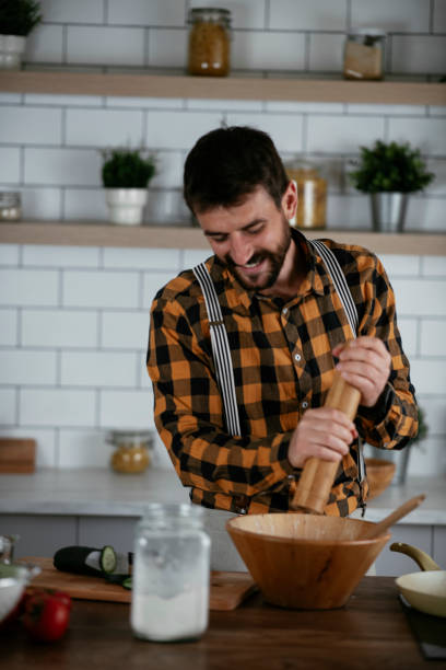 istock Young man preparing delicious food. 1265014865