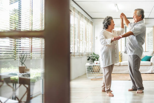 istock Romantic Asian Senior couple dancing in wedding Anniversary day 1265015020
