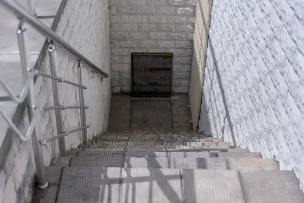 staircase with concrete steps to down of door of warehouse building industry concept