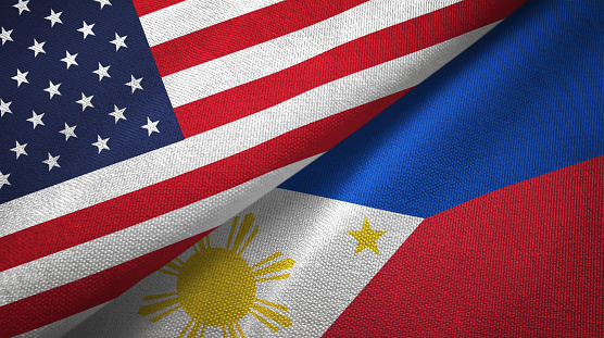 United States and Philippines two folded flags together