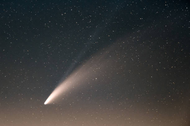 istock Neowise Comet and its long dust tail after dusk from Etna volcano 1265022184
