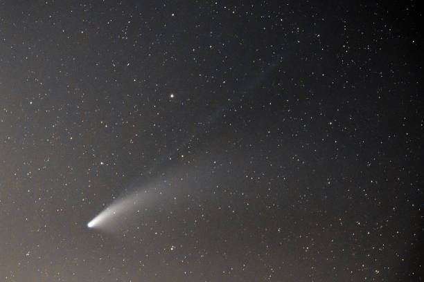 istock Neowise Comet and its double tail below Ursa Major constellation 1265022460
