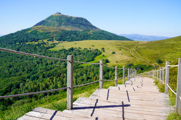 staircase wooden for access to the Puy de Dôme volcano in Auvergne france wooden staircase for access to the Puy de Dôme volcano in Auvergne france auvergne rhône alpes photos stock pictures, royalty-free photos & images
