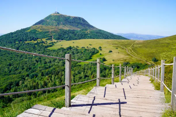 wooden staircase for access to the Puy de Dôme volcano in Auvergne france