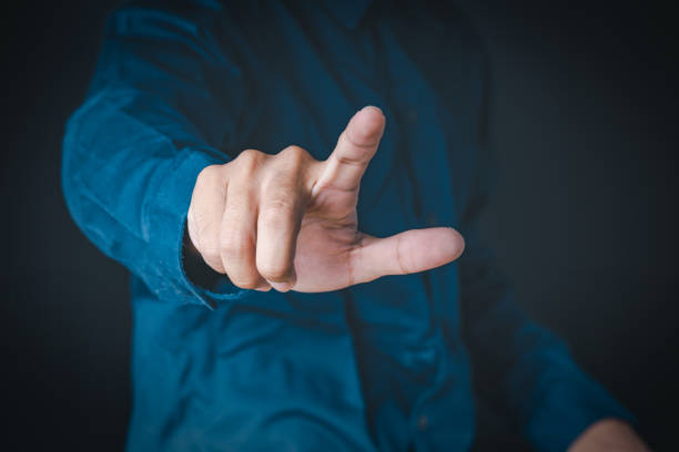 istock The man shows the gesture of pointing touching on the virtual screen and has a beehive screen effect.  Investment ideas, business concepts, technology concepts. 1265024701