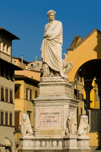 Monument of Italian poet and philosopher Dante Alighieri (1265 - 1321) on the Piazza Santa Croce in Florence, Italy. Built in 1865 by Italian sculptor Enrico Pazzi.