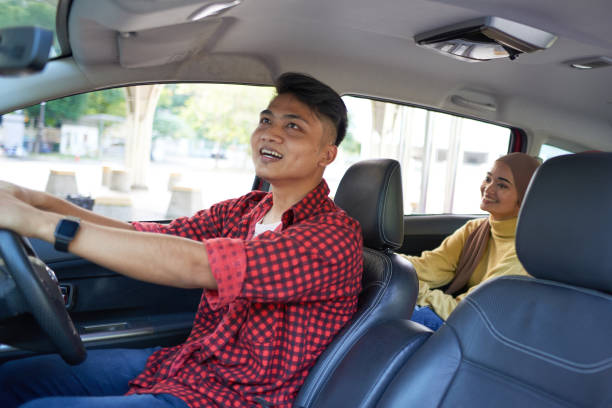 istock Asian e-hailing driver and woman in hijab 1265025057