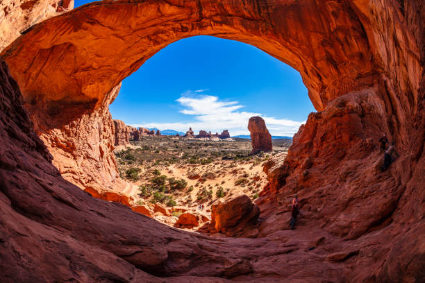 Arches National Park Moab, Utah USA - November 3, 2016: Visitors enjoying the natural beauty of the Double Arch rock formation in Arches National Park. fish eye lens photos stock pictures, royalty-free photos & images
