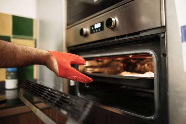 istock Taking out an oven tray with a plastic glove 1265028593