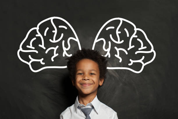 istock Happy smiling black child student boy with big brain, idea and brainstorming concept 1265028896