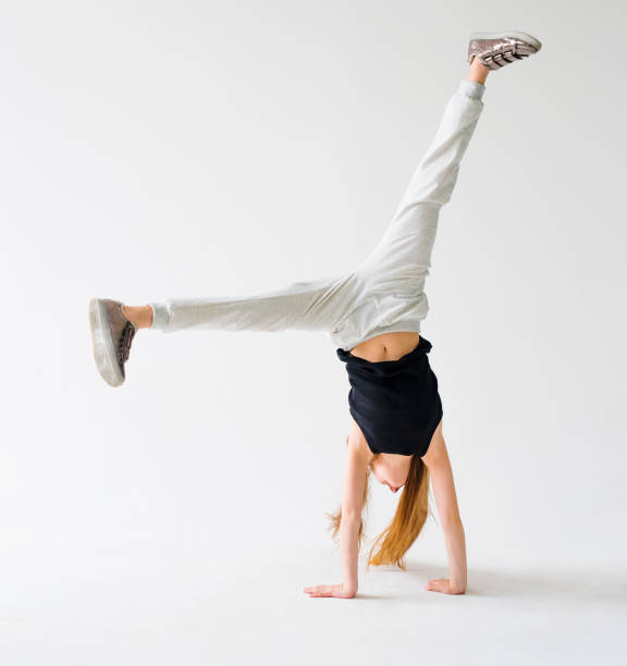 istock Little girl do a handstand 1265029500