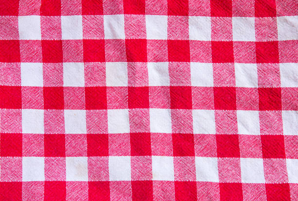 istock Checkered cloth texture. Red and white squares on textile. 1265030829