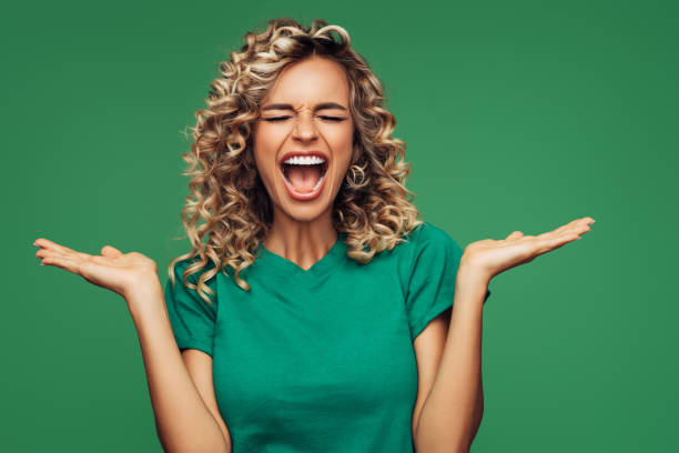 istock Beautiful woman on green background 1265033573