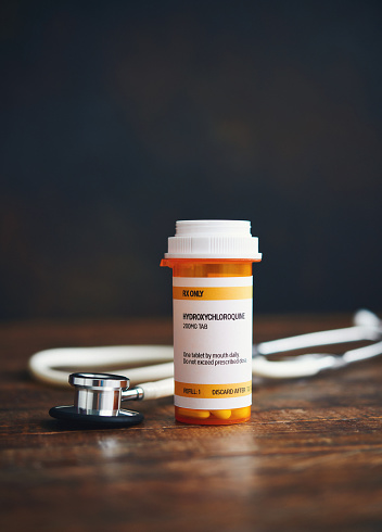 Stethoscope with Prescription Medication in Pill Bottle: Hydroxychloroquine Phosphate