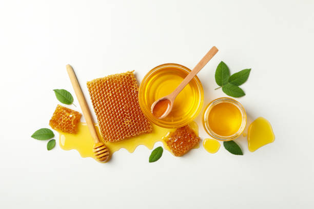 istock Composition with honeycombs, honey and dipper on white background 1265034168