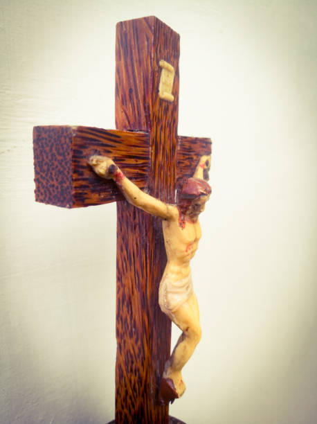 Holy cross in a white background.with god jesus hanging on it.The God jesus who got crucified in the cross is shown. Holy cross with God jesus hanging on it is placed in a white background.Can see the crucified jesus laying on the holy cross. what mountain was jesus crucified on stock pictures, royalty-free photos & images