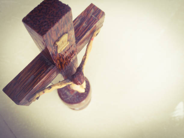 Holy cross in a white background.with god jesus hanging on it.The God jesus who got crucified in the cross is shown. Crucified jesus hanging on the holy cross is viewed from top angle.Can see the top writing on the holy cross. what mountain was jesus crucified on stock pictures, royalty-free photos & images