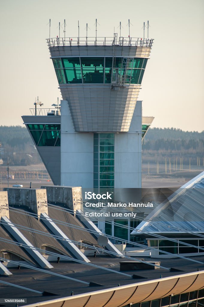 The air traffic control tower in Helsinki-Vantaa Airport operated by Finavia handles more than 600 airside operations daily. The airport is the main hub for the Finnish flag carrier Finnair. Helsinki / Finland - April 15, 2018: The air traffic control tower in Helsinki-Vantaa Airport operated by Finavia handles more than 600 airside operations daily. The airport is the main hub for the Finnish flag carrier Finnair. Aerospace Industry Stock Photo