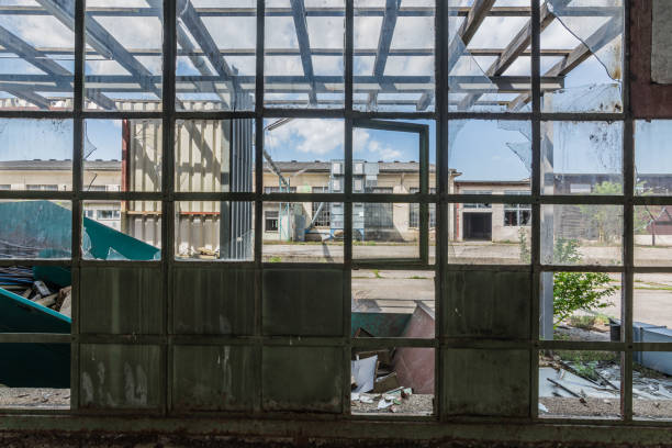 large window with a view of a factory building