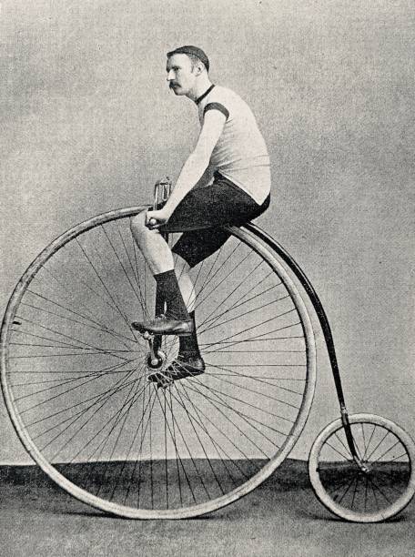 Cyclist J.H. Adams on a penny farthing bicycle, side view Illustration from 19th century penny farthing bicycle stock illustrations