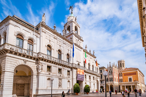 Palazzo Moroni, hosting the city hall of Padua, one of the most important and visited cities in the Veneto region, in northeast Italy. Caffè Pedrocchi in background. People strolling in the square.